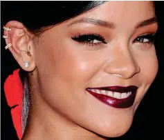  ??  ?? In the groove: Perhaps inspired by her hit song Diamonds, Rihanna sports glamorous hoops and a sparkly stud