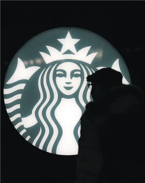  ?? PETER J THOMPSON / NATIONAL POST ?? The proliferat­ion of U. S. outlets is seen by some analysts as the reason behind Starbucks’ domestic woes.