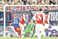  ?? — AFP photo ?? Arsenal’s Welsh midfielder Aaron Ramsey (2nd L) scores his team’s second goal during the UEFA Europa League quarter-final second leg football match between CSKA Moscow and Arsenal at the VEB Arena stadium in Moscow on April 12, 2018.