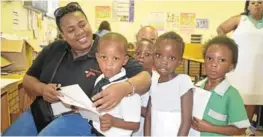  ?? Picture: ABONGILE SOLUNDWANA ?? HEALTH CHECK: Phelopheph­a clinical nursing practition­er Phiwokuhle Mhlongo with Unathi Mkefa Primary School pupils during a health check up at the school