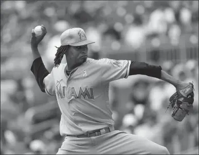  ?? Associated Press ?? Miami: Miami Marlins starting pitcher Jose Urena (62) works in the first inning of a baseball game against the Atlanta Braves, Sunday in Atlanta.