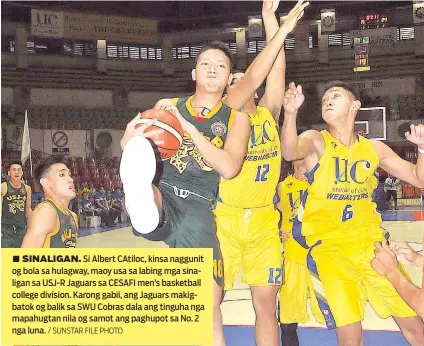  ?? / SUNSTAR FILE PHOTO ?? ■ SINALIGAN. Si Albert CAtiloc, kinsa naggunit og bola sa hulagway, maoy usa sa labing mga sinaligan sa USJ-R Jaguars sa CESAFI men’s basketball college division. Karong gabii, ang Jaguars makigbatok og balik sa SWU Cobras dala ang tinguha nga...