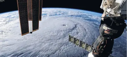  ?? PHOTO: REUTERS ?? Whirling winds . . . Hurricane Lane approaches Hawaii as shown in this photo taken from the Internatio­nal Space Station and posted on social media by astronaut Ricky Arnold.