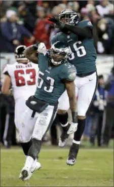  ?? THE ASSOCIATED PRESS FILE ?? The Eagles’ Nigel Bradham (53) and Derek Barnett (96) celebrate during the second half of an NFL divisional playoff football game against the Atlanta Falcons on Jan. 13 at Lincoln Financial Field.