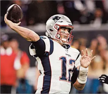  ?? DAVID J. PHILLIP/AP ?? At 42, Patriots QB Tom Brady has thrown 18 TD passes with six INTs, completing 61.1 percent of his throws this season.