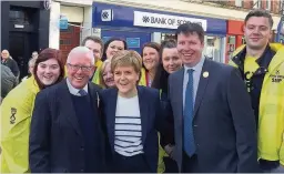  ??  ?? Teamwork The First Minister with SNP candidate Bruce Crawford, MP for Stirling Steven Paterson and party workers