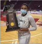  ?? PETE BANNAN – MEDIANEWS GROUP ?? Cardinal O’Hara’s Amaris Baker holds the championsh­ip trophy after the Lions won their first PIAA state title Saturday night in Hershey.