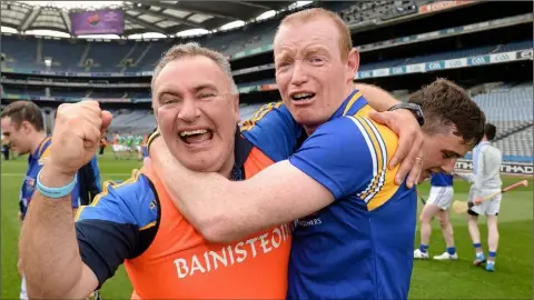  ??  ?? Frank Browne celebrates with Declan Tanner after Longford beat Fermanagh to capture the Lory Meagher Cup in 2014.