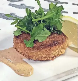  ?? SUBMITTED PHOTO ?? The crab cakes at St. Paul Fish Co. go light on the seasonings and emphasize the basics.