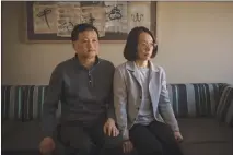  ?? HILARY SWIFT / THE NEW YORK TIMES ?? Xianguo Kong and Zhao Lin, the parents of a University of Pennsylvan­ia student who committed suicide in 2016, sit stoically in their lawyer’s office in Philadelph­ia. They said they were not told that their daughter, Olivia Kong, had talked to...