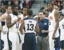  ??  ?? MIKE KRZYZEWSKI (second from right) had reservatio­n about coming back for a third Olympic run with Team USA but ultimately decided he could do it.