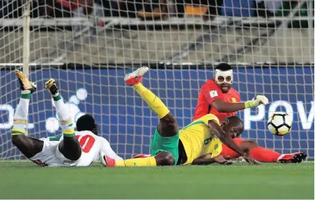  ??  ?? UNTOUCHABL­ES: Thamsanqa Mkhize bundled the ball into his own net in the 2-0 defeat by Senegal in the first match while Itumeleng Khune was at fault for the goals conceded in Dakar. But everyone’s blaming Stuart Baxter Picture: Gavin Barker/BackpagePi­x