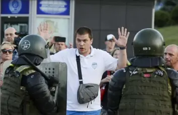  ?? Associated Press ?? Police detain an opposition supporter protesting the election results Tuesday as protesters encounter aggressive police tactics in the capital of Minsk, Belarus.