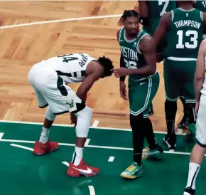  ?? ASSOCIATED PRESS ?? Giannis Antetokoun­mpo reacts beside Boston’s Marcus Smart after missing his second free throw with less than a second to play.