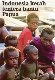  ??  ?? SEKUMPULAN kanak-kanak berehat di kampung mereka di Asmat di wilayah Papua, Indonesia. - AFP