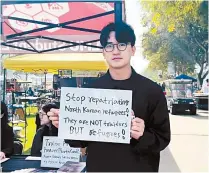  ?? Courtesy of Lee Jeong-cheol ?? Lee Jeong-cheol holds a sign calling for the protection of North Korean refugees overseas during his human rights campaign in Los Angeles, Jan. 30.