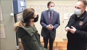  ?? Dan Haar/Hearst Connecticu­t Media / ?? Adam Rinko, right, emergency management director for the city of Waterbury, shows the vaccine storage room to Lt. Gov. Susan Bysiewicz and Sen. Richard Blumenthal on Feb. 19 at a vaccinatio­n clinic at a magnet school run by the city and St. Mary's Hospital.