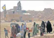  ?? AFP ?? ▪ Civilians flee the Islamic State-held holdout of Baghouz.