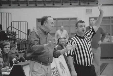  ?? Graham Thomas/Siloam Sunday ?? Former Siloam Springs boys coach and athletics director Kerwin Dees, now the head coach at Regent Prep (Okla.), talks to a referee during Friday’s Siloam Springs Holiday Classic. Dees and the Rams defeated Siloam Springs 53-37.