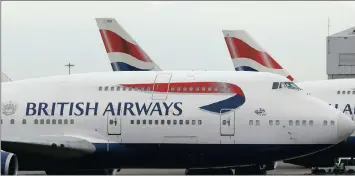  ?? PICTURE: ASSOCIATED PRESS ?? British Airways planes are parked at Heathrow Airport earlier this year. This weekend, a systems failure caused mass flight cancellati­ons, ruining the half-term holiday plans of thousands of families and causing chaos at airports.