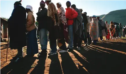  ?? EPA- EFE: Kim Ludbrook ?? Lesotho citizens queue to vote in a previous national elections.