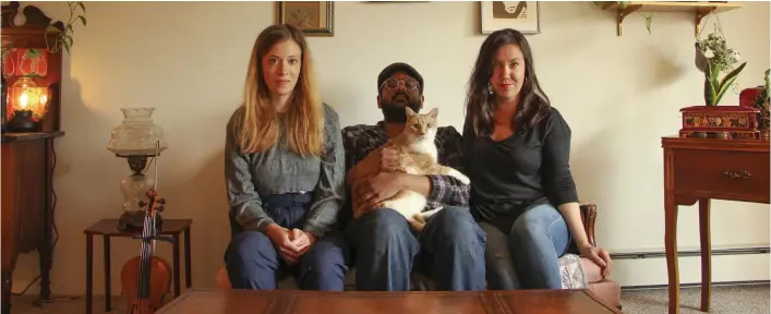  ??  ?? Violin innovator Molly MacKinnon, Rumble Theatre artistic director Jiv Parasram, and actor-playwright Christine Quintana (with Chester the cat) have taken their artistic ventures online during COVID-19.