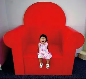  ??  ?? (ABOVE) Misr ead, 2002 A child sits on an oversized chair at the Children’s Discovery Center in Honolulu, Hawaii. Picture taken with a Nikon D1
