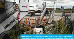  ??  ?? MANCHESTER: An aircraft grounded due to the COVID-19 pandemic, operated by Ryanair, is pictured beyond unused Swissport stairs, on the apron at Manchester Airport in Manchester, north west England. — AFP