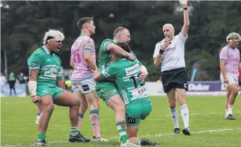  ?? JAMES FOY/NATURAL LIGHT PHOTOGRAPH­Y ?? Raymond Tuputupu, left, Slade McDowall and Kyle Brown celebrate Brown scoring a try in their game against Wellington.