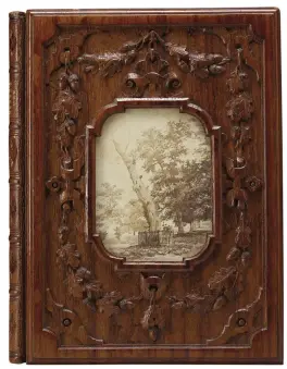  ??  ?? 10. A Treatise on the Identity of Herne’s Oak, 1867, written by William Perry and published by L. Booth, oak binding and front board, 20 × 15.3 × 2.4cm. Royal Collection Trust