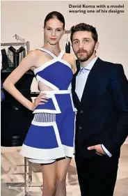  ??  ?? David Koma with a model wearing one of his designs
7