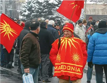  ?? AP ?? People attend a protest against Macedonia’s name change outside parliament in the capital Skopje yesterday. The change to North Macedonia is a necessary step towards the country joining Nato and the European Union.