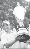  ?? Phillies at Boston Red Sox Drive
Morning ?? Kohki Idoki of Japan holds up the Alfred S. Bourne Trophy in celebratio­n after winning the Senior PGA Championsh­ip presented by KitchenAid at Bellerive Country Club on May 26, in St Louis, Missouri. (AFP)