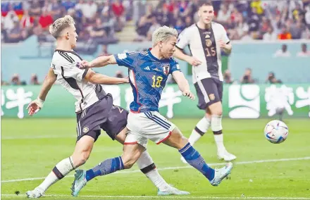  ?? Picture: Jewel SAMAD/AFP ?? Japan’s forwars Takuma Asano (No.18) scores his team’s second goal during the Qatar 2022 World Cup Group E football match between Germany and Japan at the Khalifa Internatio­nal Stadium in Doha on November 23,
2022.