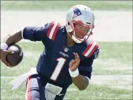  ?? Steven Senne / Associated Press ?? Patriots quarterbac­k Cam Newton runs for a touchdown against the Dolphins on Sept. 13.