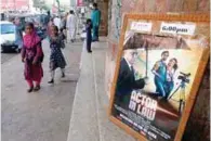  ?? - Reuters ?? EXHIBITION SUSPENDED: An advertisin­g poster for a Pakistani film with Indian actors is seen outside a movie theatre in Karachi, on Friday.