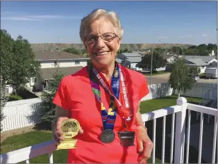  ?? SUBMITTED PHOTO ?? Hatter Bernardine Meulenbroe­k, 86, holds up her medals from this past week after participat­ing in the Scotiabank half marathon in Calgary, and placing first in her division for the race, and first in Canada for her age group.