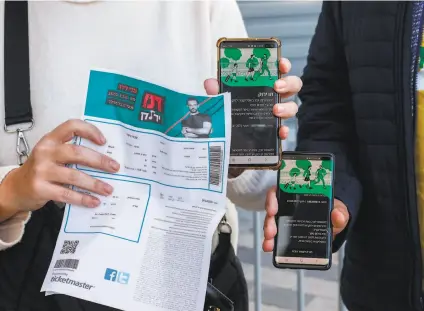  ?? Jack Guez / AFP / Getty Images ?? Israelis produce “green passes,” proof of being vaccinated against COVID, to get into a concert in Tel Aviv last month.