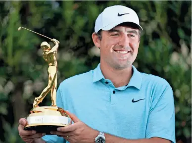  ?? ?? Scottie Scheffler celebrates after winning The Players Championsh­ip on Sunday in Ponte Vedra Beach, Fla.