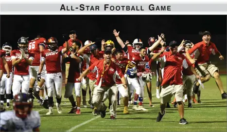  ?? RECORDER PHOTO BY CHIEKO HARA ?? East reacts as their quarterbac­k Jeremiah Galavis jumps over the last West's defender Juneboy Tumany to score a could-be gamewinnin­g touchdown Saturday, at the end of the fourth quarter of the 50th annual East vs West Tulare-kings All-star Football...