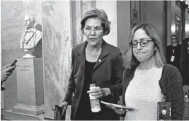  ?? J. SCOTT APPLEWHITE/AP ?? Presidenti­al hopeful Sen. Elizabeth Warren departs the Capitol after the impeachmen­t trial wrapped for Saturday. Some polls show Warren still among the front-runners in Iowa.