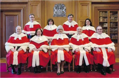  ?? ADRIAN WYLD/The Canadian Press Files ?? The Supreme Court justices pose during the official welcoming ceremony for Supreme Court of Canada Justice Suzanne Cote on Tuesday in Ottawa. Top row, from left, Clement Gascon, Andromache Karakatsan­is, Richard Wagner and Cote. Bottom row, from left,...