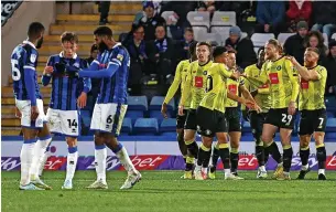  ?? Phil Oldham/rex/shuttersto­ck ?? ●●Dale players hold a quick inquest after Luke Armstrong had scored Harrogate’s second goal in Saturday’s heavy loss