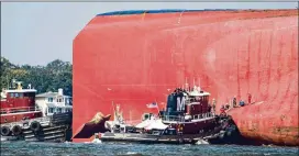  ?? SEAN RAYFORD / GETTY IMAGES ?? Emergency responders worked Monday to successful­ly rescue crew members from the capsized cargo ship off the Georgia coast at St. Simons Island.