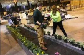  ?? SUBMITTED ?? Thomas Keller (Midview) and Savannah Roby (Wellington) start to lay out the flowers in their display at the Great Big Home and Garden Show