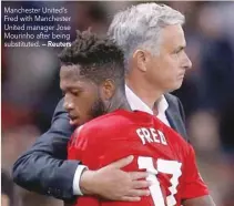  ?? — Reuters ?? Manchester United’s Fred with Manchester United manager Jose Mourinho after being substitute­d.