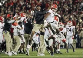  ?? GREGORY BULL — THE ASSOCIATED PRESS FILE ?? In this Monday file photo, Georgia linebacker Lorenzo Carter (7) celebrates with teammates after blocking a field goal against Oklahoma during overtime in the Rose Bowl NCAA college football game, in Pasadena Georgia coach Kirby Smart is concerned the...