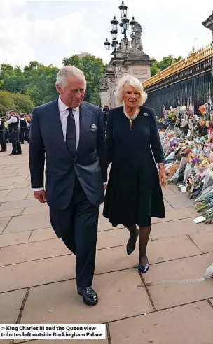  ?? ?? King Charles III and the Queen view tributes left outside Buckingham Palace