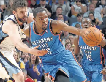  ?? NIKKI BOERTMAN / THE COMMERCIAL APPEAL ?? Oklahoma City forward Kevin Durant is fouled by Grizzlies center Marc Gasol (left) during Memphis’ 92- 89 overtime loss in Game 4 on Saturday night at FedExForum. Thunder guard Reggie Jackson, who scored 32 points, is at right.