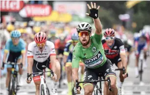  ?? AFP ?? Peter sagan celebrates as he crosses the finish line to win the 13th stage. —